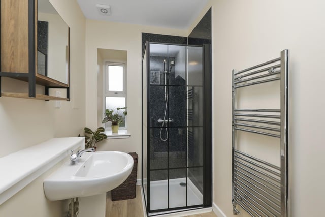 The stylish shower room, situated on the ground floor.