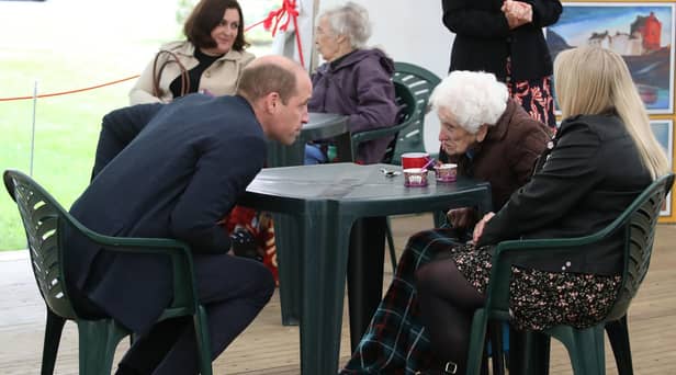 The Duke of Cambridge chats to Betty Magee, a resident of Queen's Bay Lodge Care Home in Edinburgh, and her granddaughter Kimberley Anderson during his visit. Picture: Andrew Milligan/PA Wire.