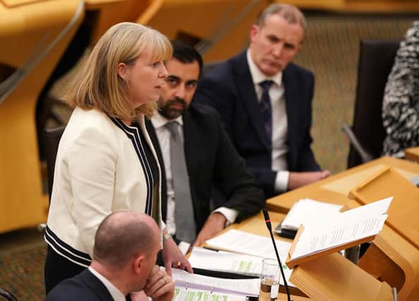 First Minister Humza Yousaf alongside Deputy First Minister Shona Robison as she outlines the draft budget for 2024-25 in a statement to MSPs in the Scottish Parliament. Photo: Andrew Milligan/PA Wire