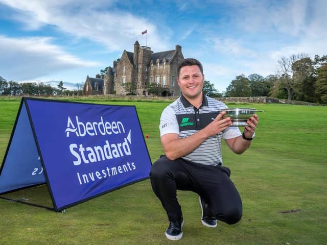 Dunbar's Neil Fenwick shows off the trophy for topping the Tartan Pro Tour Order of Merit to secure a spot in next week's Aberdeen Standard Investments Scottish Open at The Renaissance Club. Picture: Kenny Smith