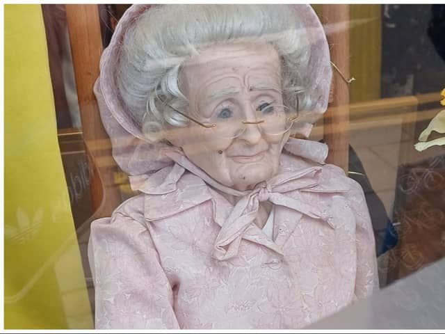 Another 'creepy' doll has appeared in an Edinburgh shop window – this time at the Marie Curie charity store in Morningside. Photo: Gordon McDonald