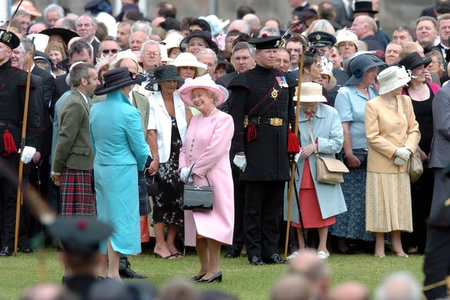 The Queen at one of the regular garden parties held at the Palace of Holyrood in 2004.
