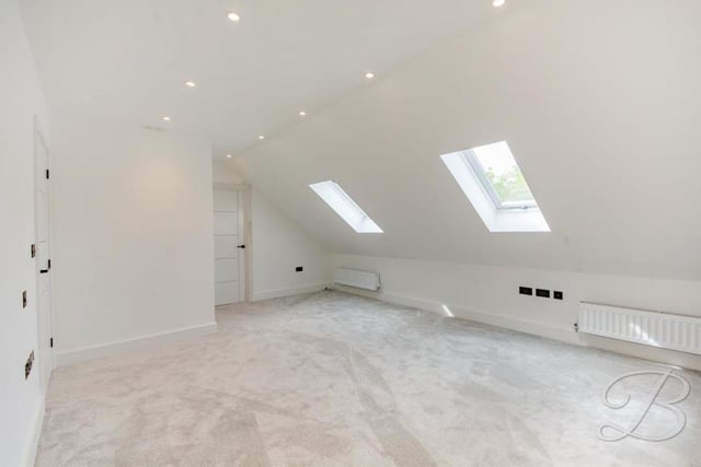 The master bedroom has access to not only a larger-than-average en suite but also a dressing room. It has two Velux roof windows.