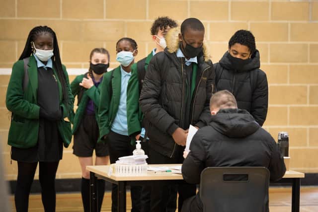 Pupils at Sydney Russell School, Dagenham, east London queue up to be tested for Covid-19 as pupils in England return to school for the first time in two months as part of the first stage of lockdown easing.
