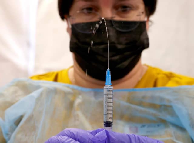 A healthcare worker prepares a dose of the Pfizer-BioNtech Covid-19 vaccine (Picture: Jack Guez/AFP via Getty Images)