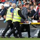 Hearts defender Nathaniel Atkinson leaves the pitch on a stretcher at St Mirren. Pic: SNS