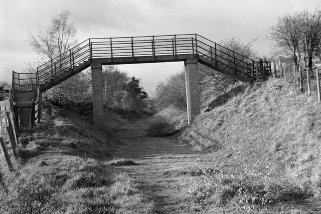 A disused overbridge on the Roslin to Glencorse route, part of the Borders railway line in November 1970.
