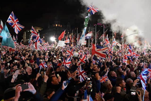Brexit supporters wave Union flags on the day the UK formally left the European Union (Picture: Daniel Leal-Olivas/AFP via Getty Images)