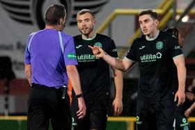 Ryan Porteous, along with Hibs defender Paul Hanlon, argue with referee Euan Anderson after Hibs' 1-0 defeat to Dundee United at Tannadice. Picture: SNS