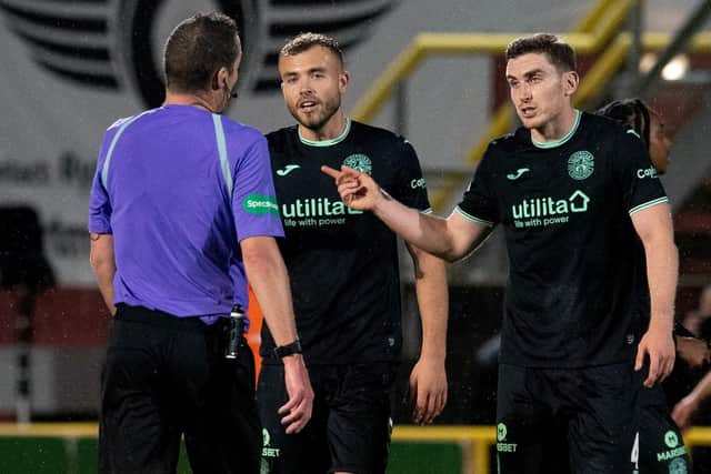 Ryan Porteous, along with Hibs defender Paul Hanlon, argue with referee Euan Anderson after Hibs' 1-0 defeat to Dundee United at Tannadice. Picture: SNS