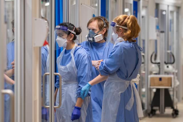 Staff check on patients suffering with Covid-19 on the critical care unit at the Royal Papworth Hospital, Cambridge picture: PA