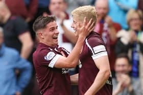 Alex Cochrane is congratulated by Cameron Devlin after scoring for Hearts.