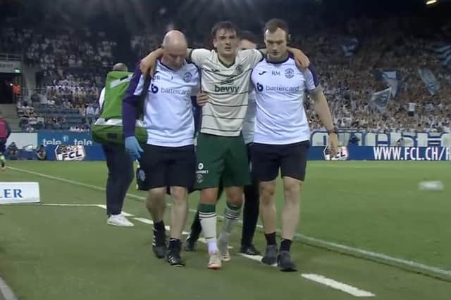Dylan Levitt is helped off the pitch by club doctor Duncan Reid and Sports Therapist Rory Monks. Picture: Contributed