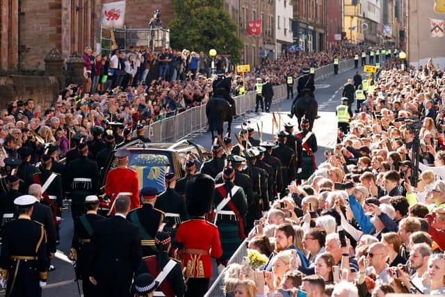 Crowds watch as King Charles III and other members of the Royal Family walk behind Queen Elizabeth II's coffin on its way from the Palace of Holyroodhouse to St Giles Cathedral (Picture: Odd Andersen/WPA pool/Getty Images)