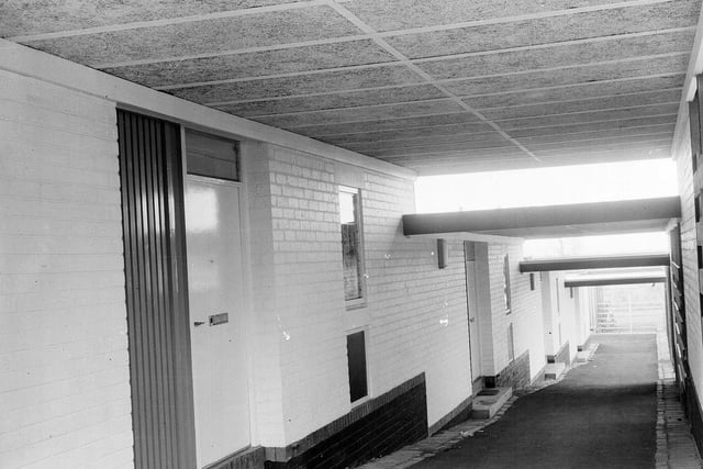 One of the covered walkways giving access to homes at an experimental housing scheme at Prestonpans that was managed by Edinburgh University's Architectural Research Unit in 1962.