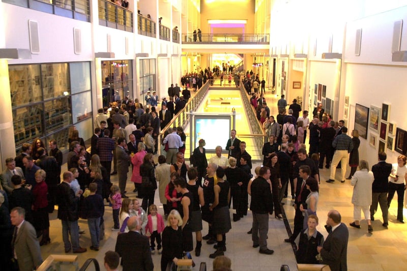The Ocean Terminal opening party in 2001, with guests pictured mingling in the new mall.  The land was formerly occupied by the Henry Robb shipyard, which closed in 1983.