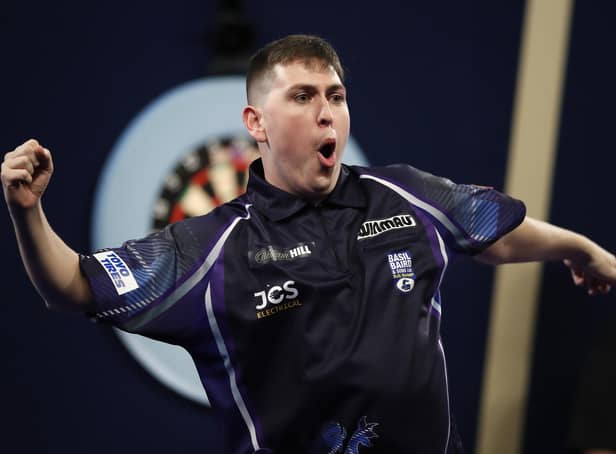 William Borland of East Calder reacts to his stunning nine-dart finish during his first round match against Bradley Brooks at Alexandra Palace