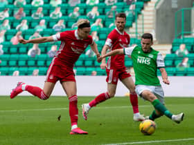 Paul McGinn gets a foot in to prevent Ryan Hedges from having a chance on goal