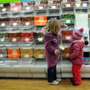 Children at the pick 'n' mix aisle on the last day of the Woolworths store at Leith before it closed for good in 2008.