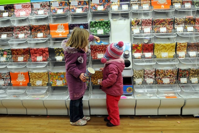 Children at the pick 'n' mix aisle on the last day of the Woolworths store at Leith before it closed for good in 2008.