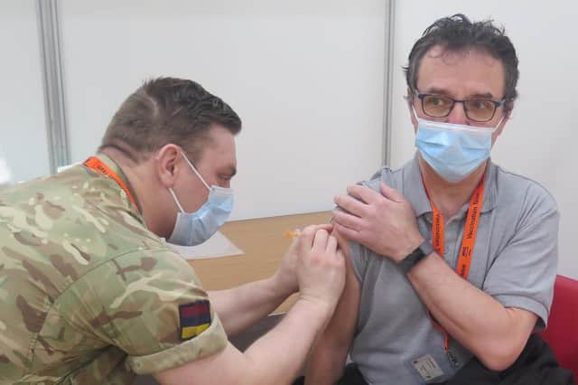 Phil Whittaker was vaccinated by Corporal Cameron Jobson-Wood of the British Army’s Medical Corp