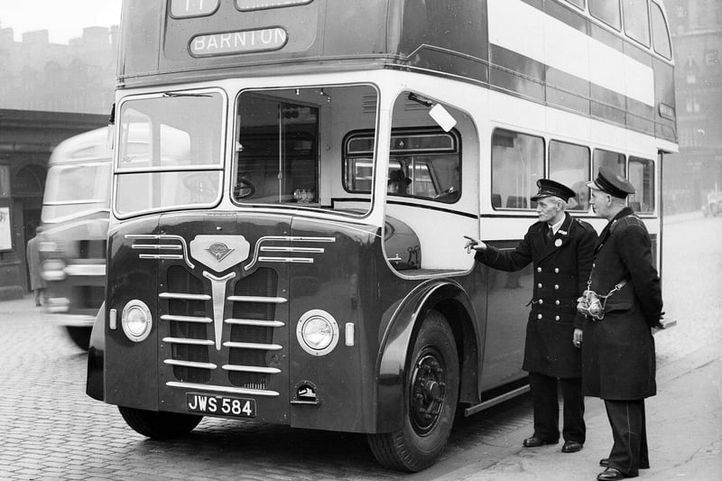 Edinburgh's latest double decker bus is examined by a driver and a conductor at Shrubhill depot. The bus was one of 60 that were bought from London and reconditioned and rebodied.