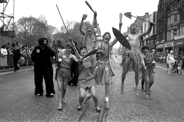 Students dressed as cavemen and 'Geezyerlot tribesmen' in the Edinburgh University Student Charities Week parade along Princes Street in April 1984.