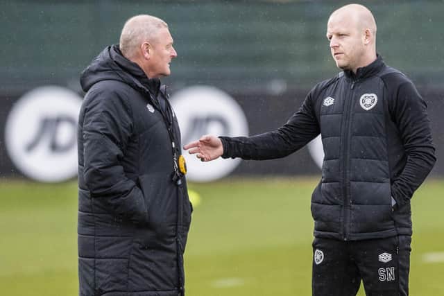 Steven Naismith talks things over with Frankie McAvoy at Hearts training on Thursday. Picture: SNS