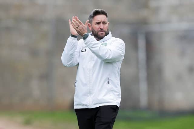 Hibs boss Lee Johnson applauds the away fans after the 1-1 draw with St Johnstone at McDiarmid Park