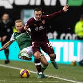 Jimmy Jeggo of Hibs and Hearts' Barrie McKay in action during the last Edinburgh derby meeting