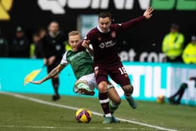 Jimmy Jeggo of Hibs and Hearts' Barrie McKay in action during the last Edinburgh derby meeting