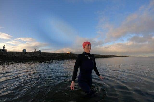 Braving a chilly dip: Evening News reporter Jolene Campbell at Wardie Bay