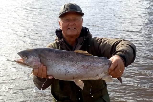 Ronnie Robinson with a big trout caught at Harlaw Reservoir.