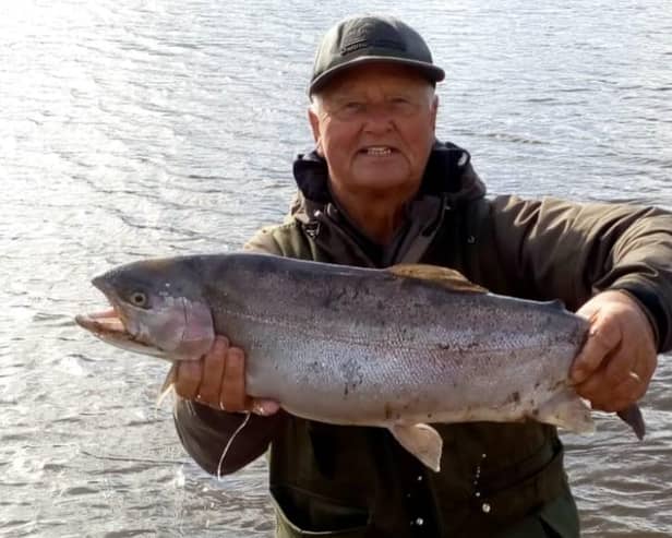 Ronnie Robinson with a big trout caught at Harlaw Reservoir.