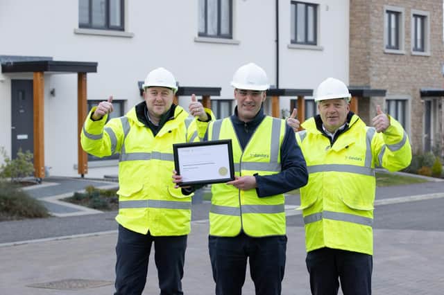 From left to right: Stuart Barton, Gerard McGuinness and John Kerr with the Quality Recognition Award certificate.