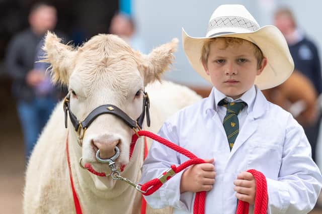 One young handler shows off his prized animal at last year's Royal Highland Show, as the event celebrated its 200th anniversary and the return to its four-day run after two years of Covid restrictions.