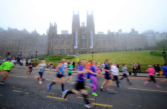 Edinburgh Marathon can attract some unusual spectators from revellers who spent the night on the street to ghosts on their way to work (Picture: Jane Barlow/PA)