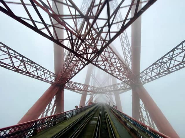 A train manager acting in the “spur of the moment” has captured a rare set of images of the Forth Bridge shrouded in fog. (Taylor Bennie)