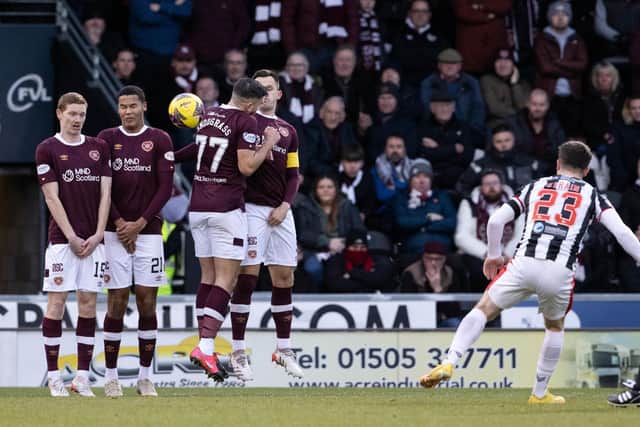 Ryan Strain's free-kick deflects off Toby Sibbick (second from left) to give St Mirren an early lead over Hearts. Picture: SNS