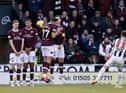 Ryan Strain's free-kick deflects off Toby Sibbick (second from left) to give St Mirren an early lead over Hearts. Picture: SNS