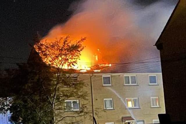 Six people have been taken to hospital after a fire broke out in top story flat in Loanhead,  Edinburgh, early this morning.