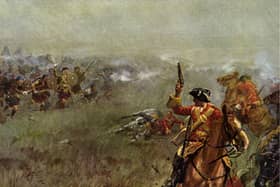 A stock photo of a painting of redcoats taking on Scottish clansmen.
