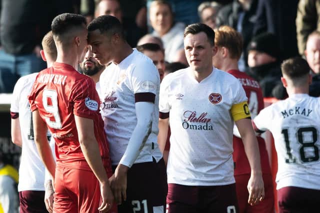 Toby Sibbick and Bojan Miovski after the James Hill tackle on Duk and subsequent reaction. Four players were booked. Picture: Paul Devlin / SNS