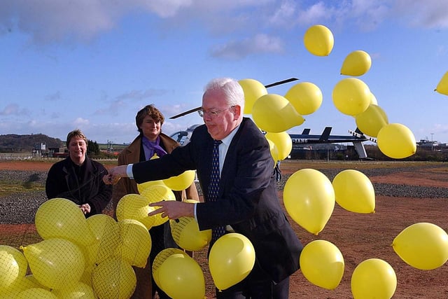 Deputy First Minister and Scottish Lib Dem leader Jim Wallace releases some yellow balloons before leaving Edinburgh on a whistle-stop two-day tour of Scotland to mark the start of his party's campaign. 
The Lib Dems finished with the same number of seats and had a second term in coalition government with Labour before the SNP won power in 2007.  But Mr Wallace stepped down as party leader and Deputy First Minister in 2005, to be succeeded by Nicol Stephen.  Mr Wallace later became a life peer, served as Lord Advocate in the UK Conservative-Lib Dem coalition and was leader of the Lib Dems in the Lords.