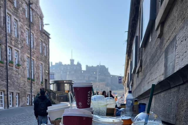 Rubbish bins only steps away from Edinburgh Castle were overflowing on Monday.