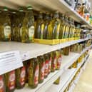 Here, cooking oil is limited on shelves in a Sainsbury's store in Kent. Photo: Gareth Fuller/PA Wire