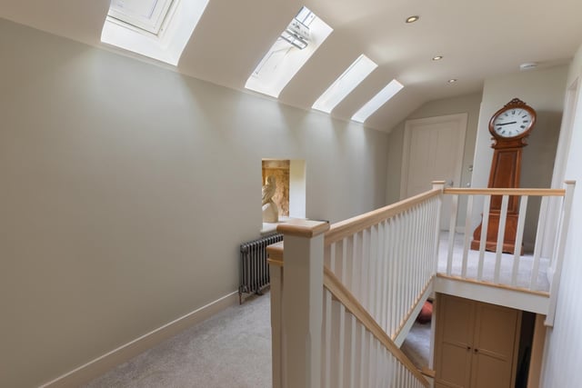 Skylights and a column radiator add brightness and interest on the landing.