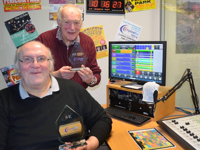 Crystal FM's Eric Platten (foreground) and Colin McCall with the back-to-back awards from SME News, Scottish Enterprise Awards.