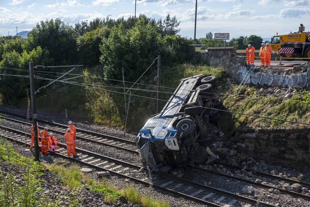 A lorry left the road, crashing through a wall and blocking the East Coast mainline train line - the main rail artery between Scotland and London.