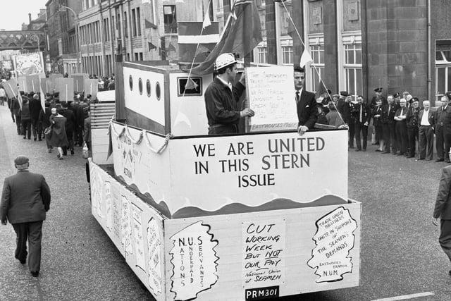 Miners show solidarity with the National Union of Seamen as they ride down Edinburgh's Leith Walk in a float on the Scottish Miners' Gala Day in June 1966